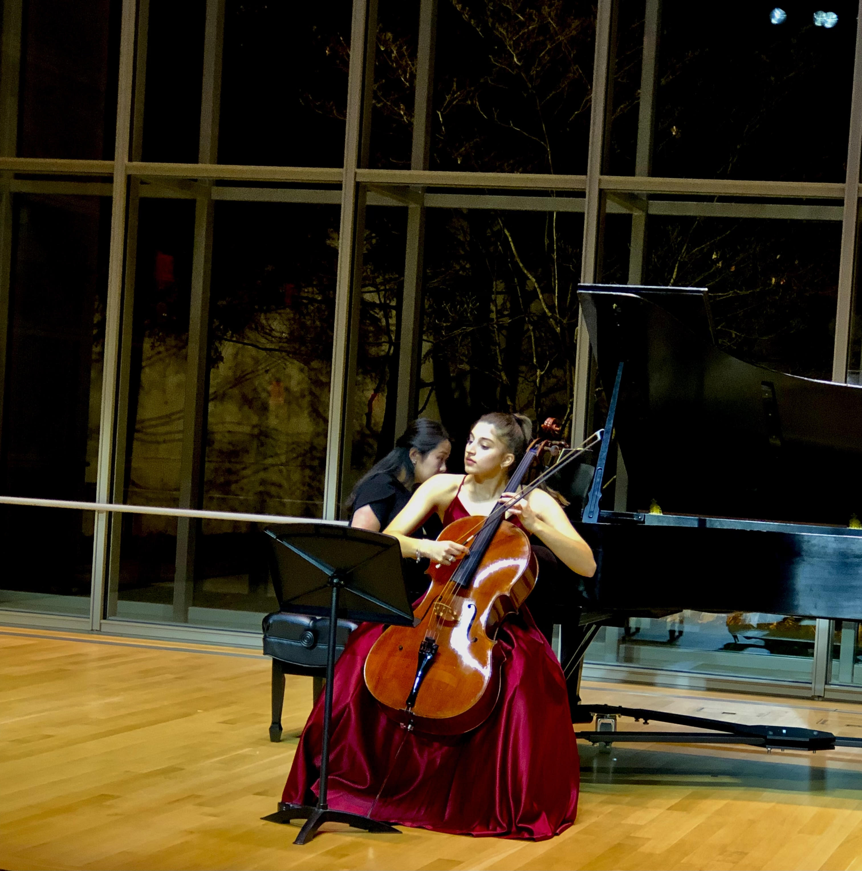 Cellists performing on stage